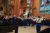 The Royal Aires drum and bugle corps, who lost three members to the OLA fire, performed at the memorial mass.